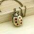 Montre collier coccinelle points rouges